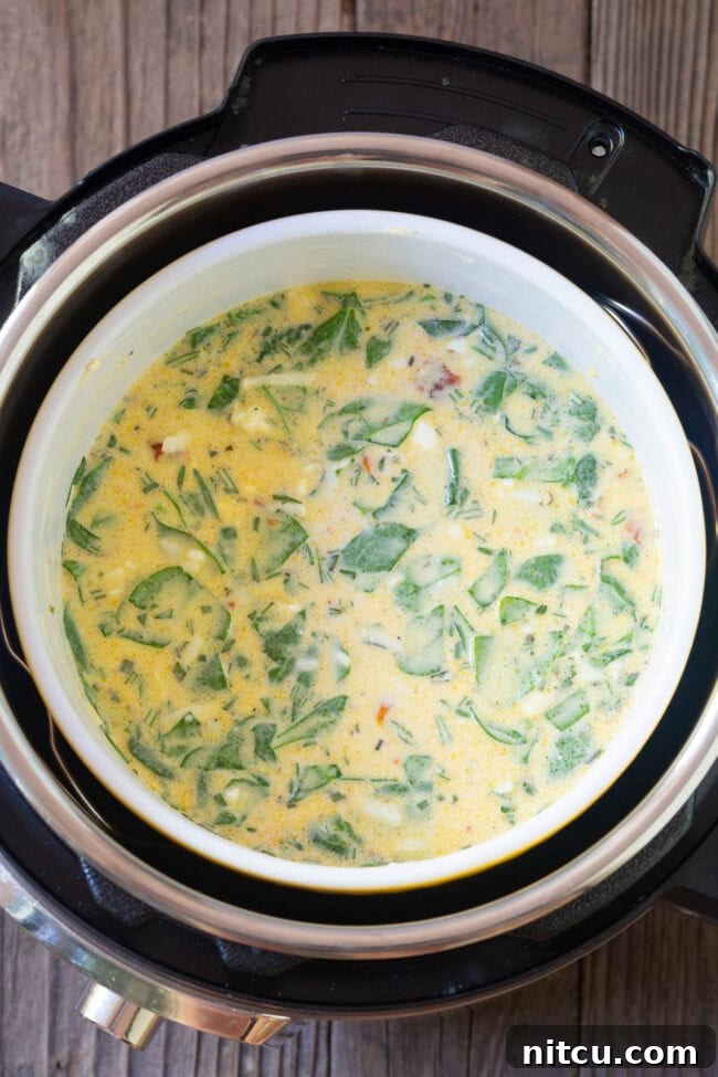 Simple Instant Pot Keto Crustless Quiche 6 Souffle dish with quiche mixture being carefully placed into the Instant Pot before cooking.