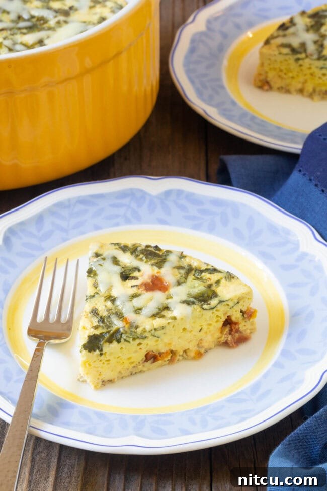 Simple Instant Pot Keto Crustless Quiche 8 Close-up of a slice of fluffy, perfectly cooked quiche on a plate, highlighting its smooth texture and rich fillings.