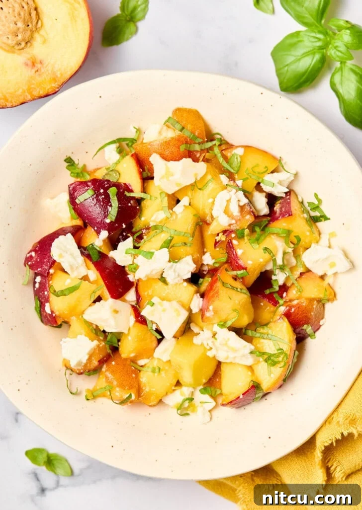 Refreshing Peach and Basil Salad 4 A bowl of fresh Basil Peach Salad, beautifully garnished and ready to serve, showcasing the vibrant colors of summer.