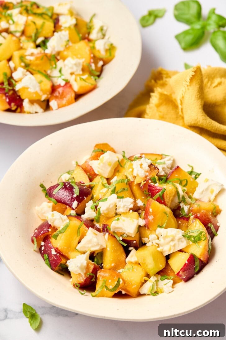 Refreshing Peach and Basil Salad 5 Easy summer salad with peaches and basil beautifully presented in individual bowls, perfect for a refreshing meal.