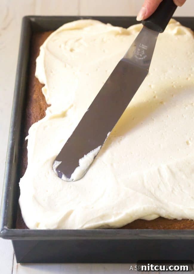 Harvest Pumpkin Slab Cake 8 The smooth, combined batter for Moist Pumpkin Texas Sheet Cake in a stand mixer bowl.