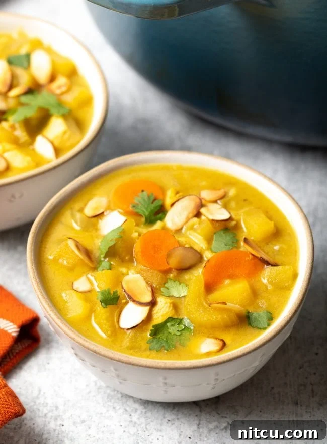 Nourishing Mulligatawny Delight 2 A bowl of vibrant, healthy Mulligatawny soup, garnished and ready to be enjoyed.