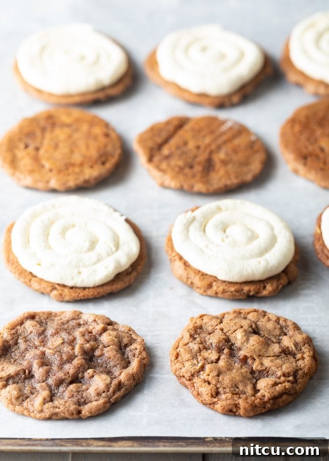 Chewy Oatmeal Cream Pie Bliss 5 Oatmeal cookies topped with generous dollops of fluffy cream pie filling, ready for their top layer.