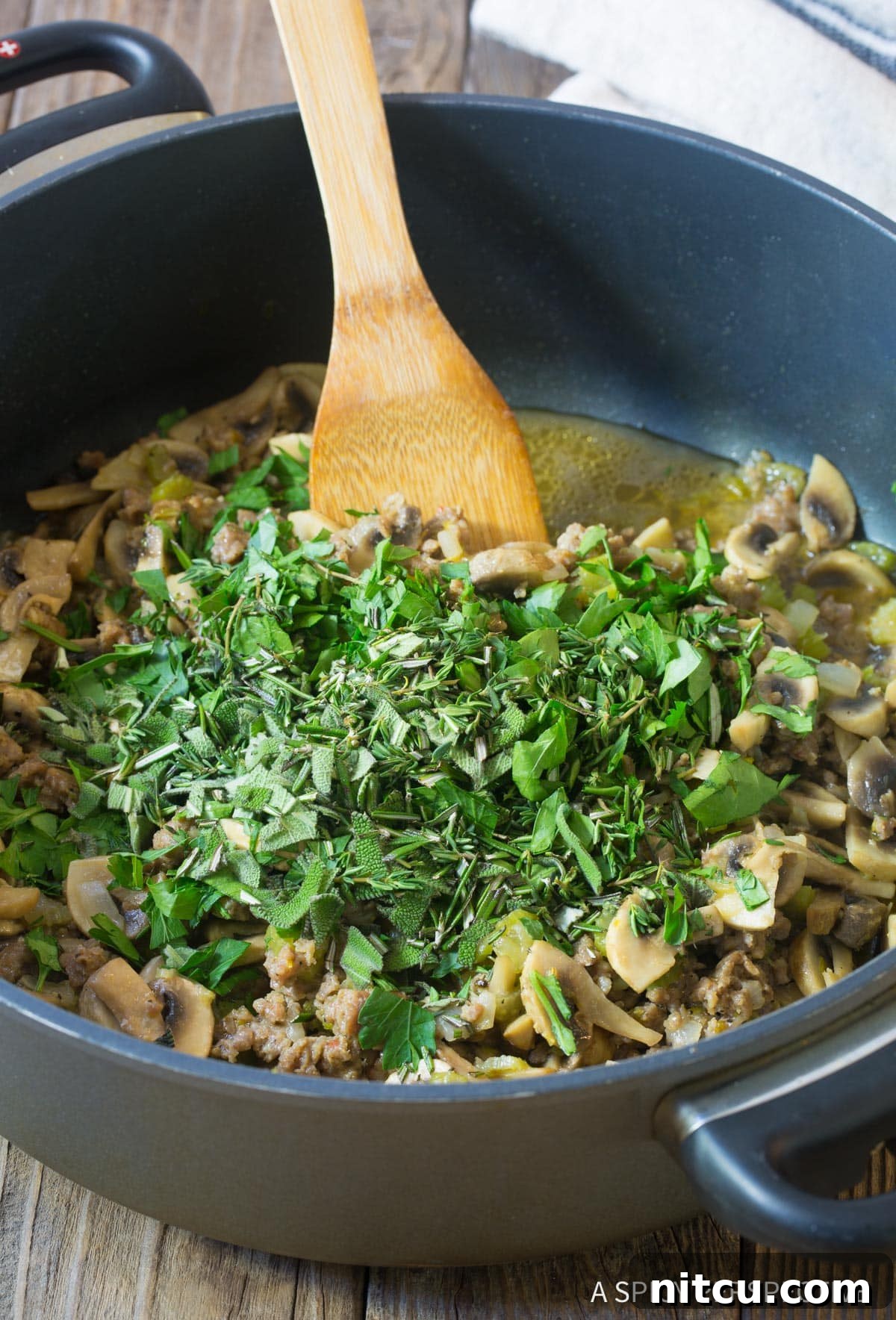Savory Mushroom and Sausage Dressing 6 Adding fresh herbs to Thanksgiving stuffing