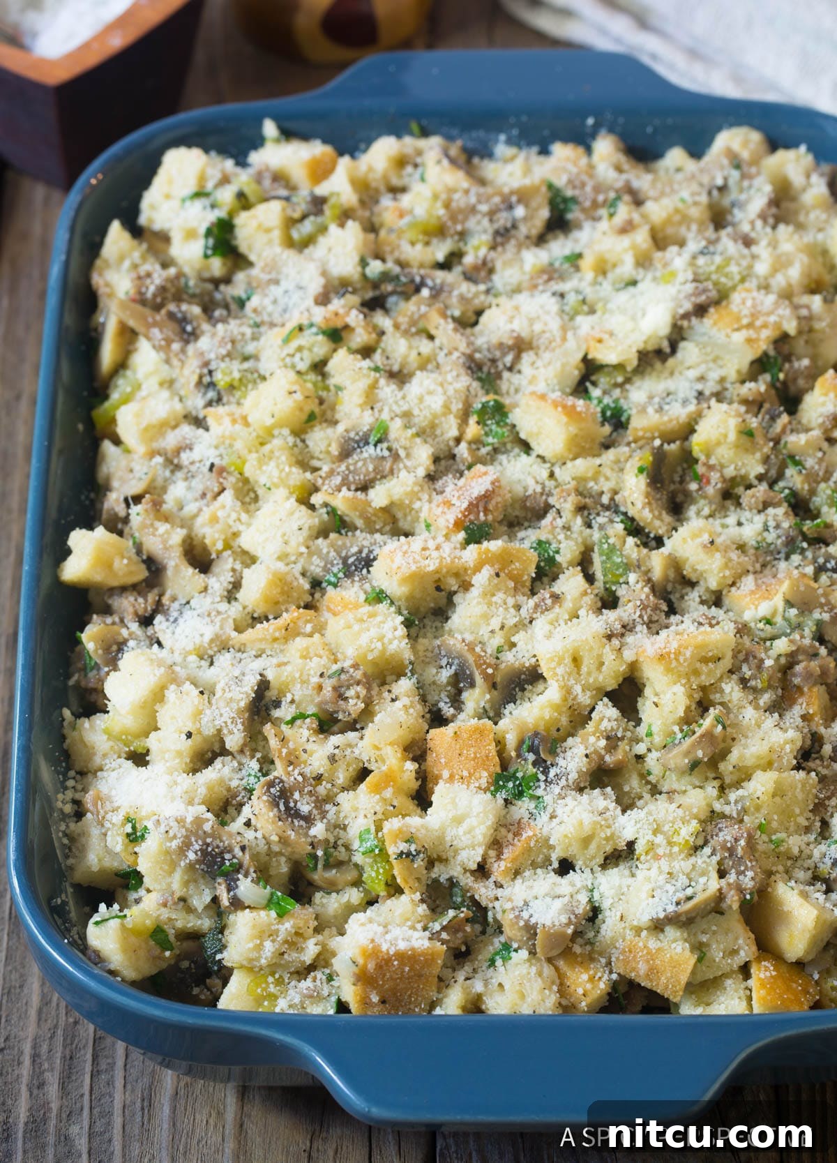 Savory Mushroom and Sausage Dressing 7 Unbaked thanksgiving stuffing with mushrooms and sausage - cheese on top