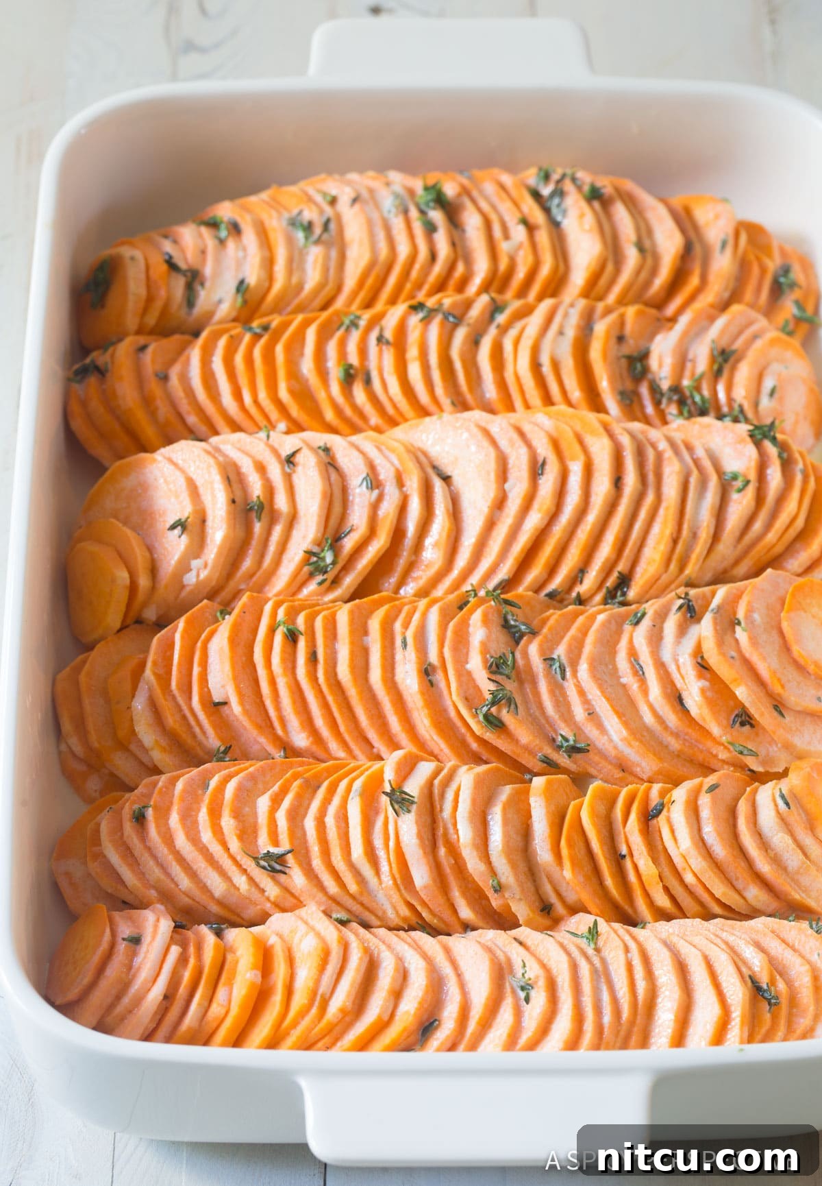 Scalloped Sweet Potato Au Gratin - in casserole dish before baking