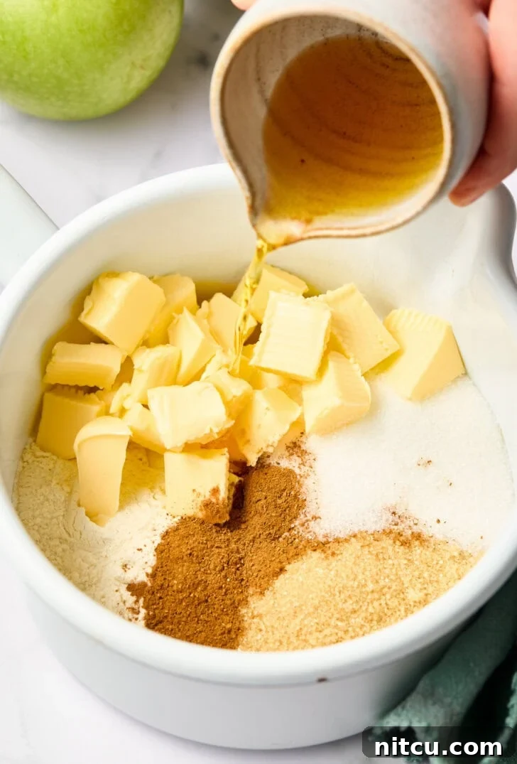 Individual Apple Tarts 4 Mixed apple filling ingredients being prepared to pour over diced apples for a rich flavor.