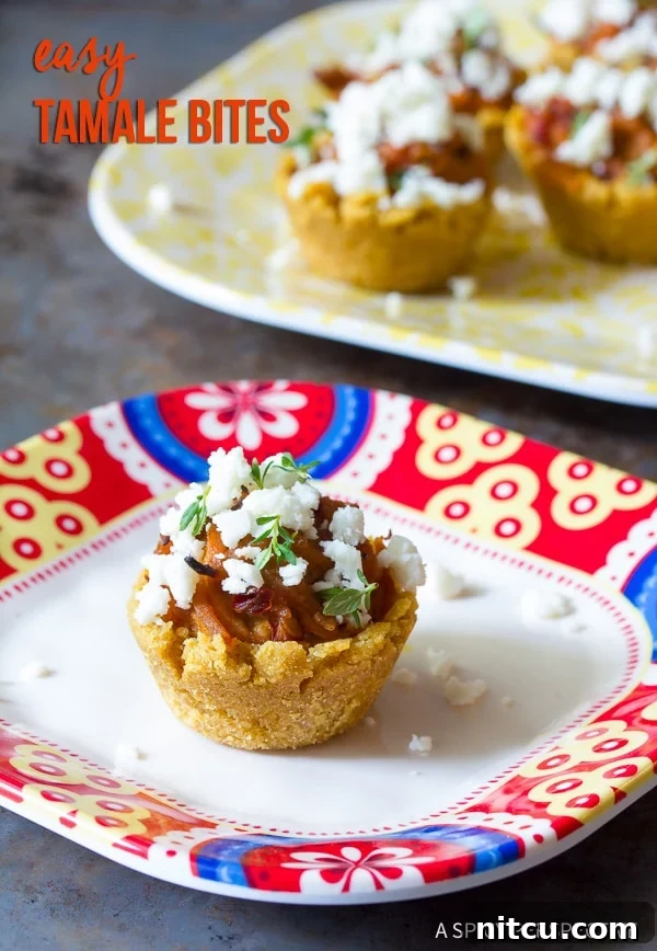 Bite-sized Tamales 2 Mini Tamales topped with fresh herbs and crumbled queso fresco, presented elegantly on a serving dish.