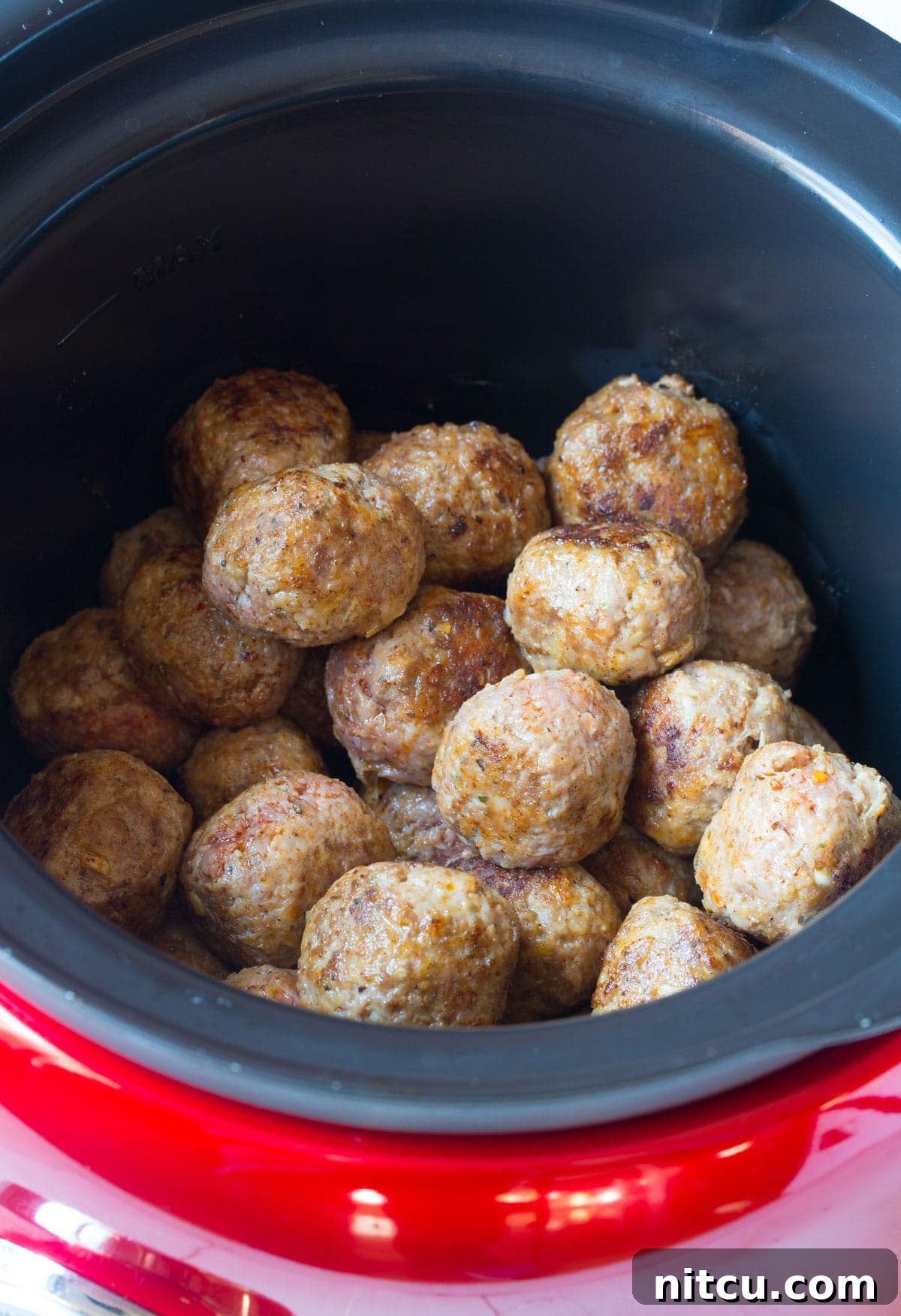 Crockpot Party Meatballs 6 Placing either homemade or frozen meatballs into the slow cooker for simmering