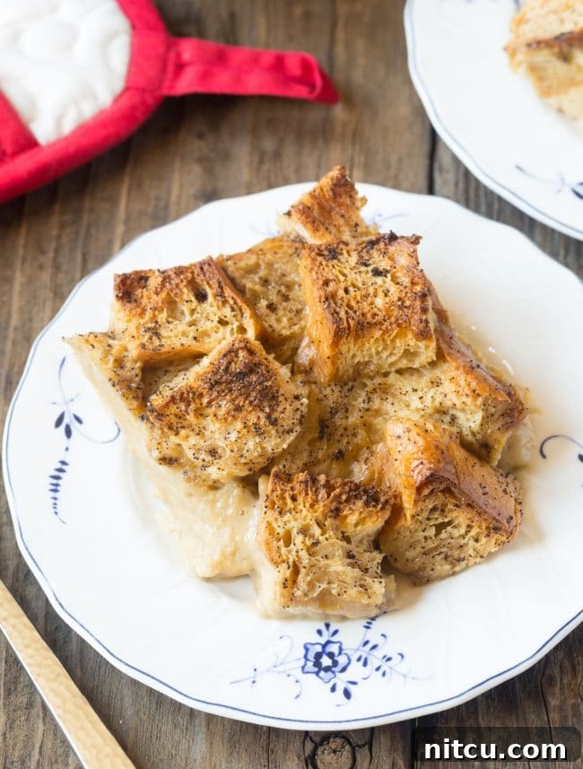 Espresso Bread Pudding Bliss 4 Piece of bread pudding on a white plate.