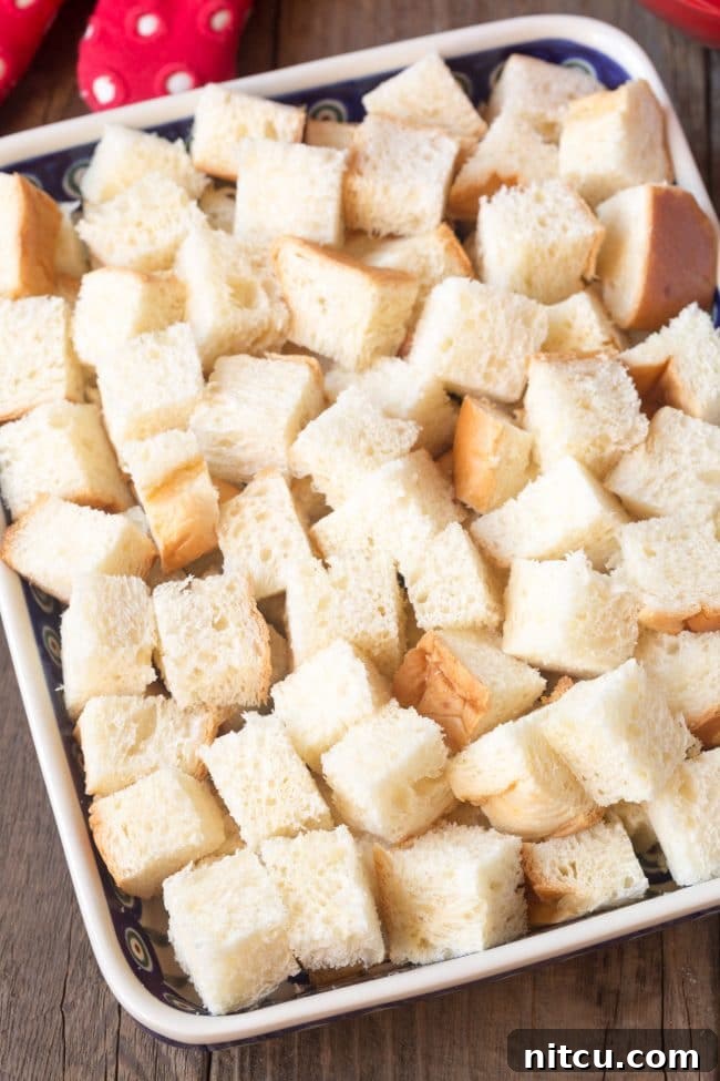 Espresso Bread Pudding Bliss 5 Cubes of brioche bread in a baking pan.