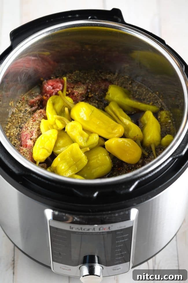 Savory Italian Beef 8 Instant Pot set to pressure cook for Italian Beef recipe, lid secured.