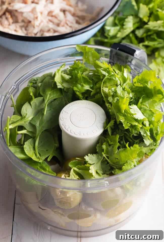 Creamy Swiss Enchiladas 7 Blender jar with salsa verde ingredients before blending.