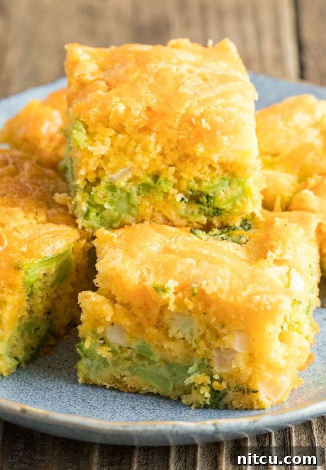 Garden Harvest Cornbread 7 Close-up of Jiffy Broccoli Cornbread on a plate, showing embedded broccoli pieces and melted cheese