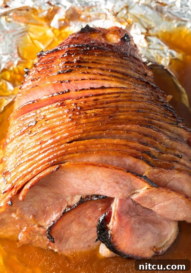 Coca-Cola Uncut 2 Coca-Cola Baked Ham Recipe overhead shot, showcasing a perfectly glazed, spiral-cut ham ready to serve.
