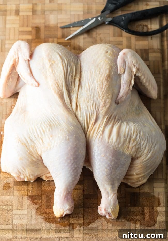 Coca Cola Glazed Spatchcock Chicken 6 Finished spatchcocked chicken laid flat on cutting board.