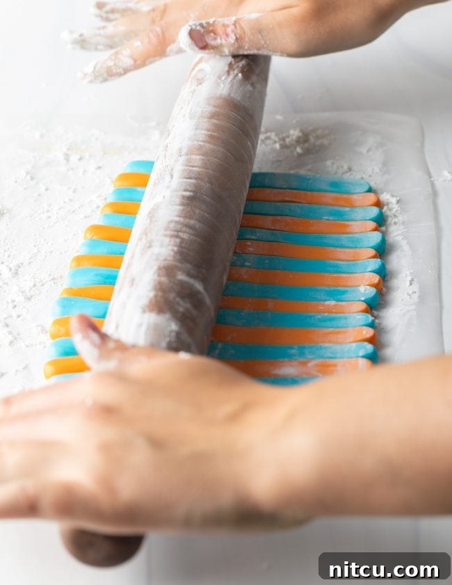 Easy Homemade Fondant 10 Hand rolling out fondant.