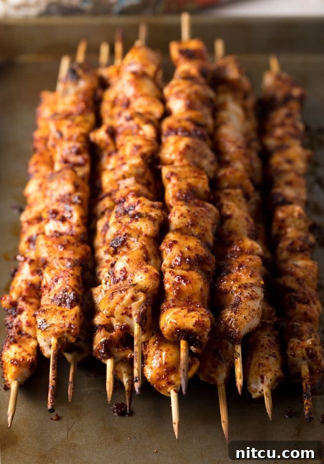 Gochujang Glazed Chicken Skewers 7 Marinating chicken pieces in a bowl for Korean skewers.