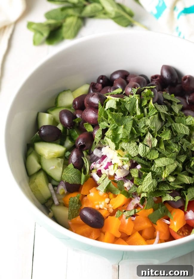 Horiatiki Greek Village Salad 6 Easy Greek Horiatiki (Village Salad) Recipe showing the chopped vegetables in a bowl. #greek #salad #glutenfree #lowcarb #keto #vegetarian