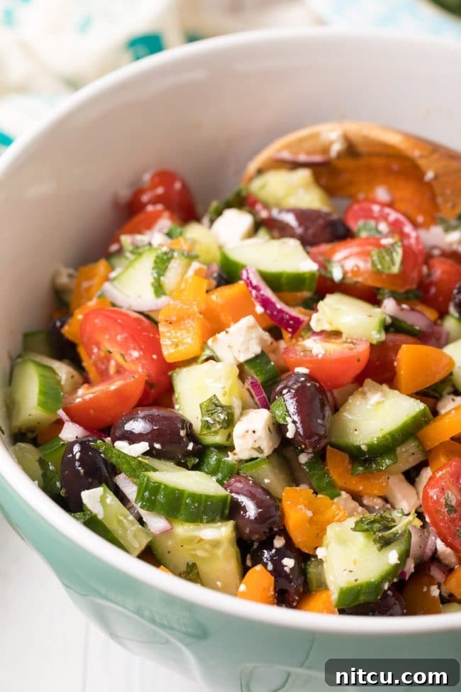 Horiatiki Greek Village Salad 9 Perfect Greek Horiatiki (Village Salad) Recipe served in a bowl, showing the large chunks of vegetables and feta.