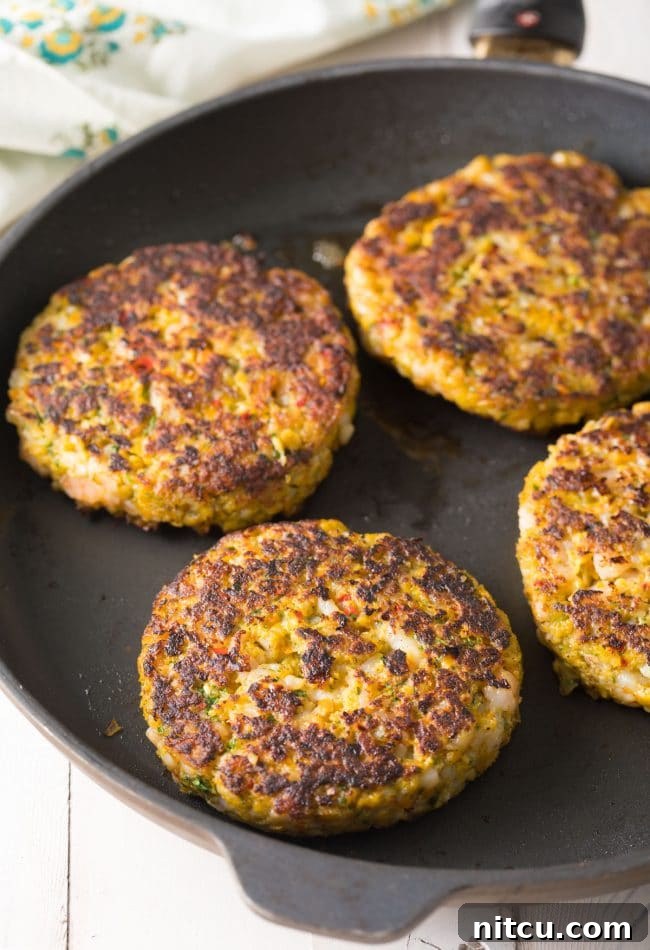 Gourmet Shrimp Burgers 11 Cooking Caribbean Shrimp Patties in a skillet to perfection
