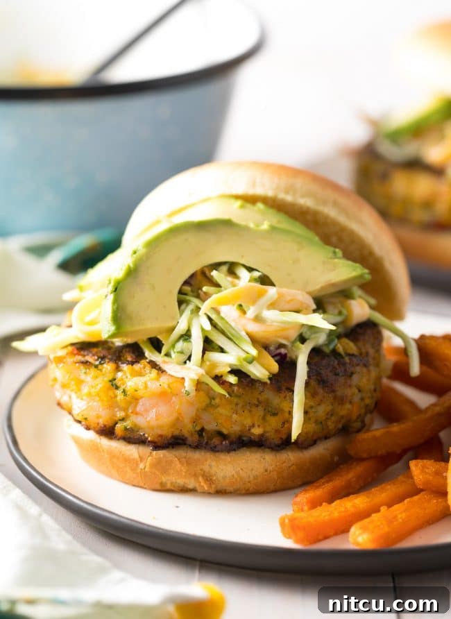Gourmet Shrimp Burgers 14 Shrimp Burger with lots of toppings, including avocado and mango slaw