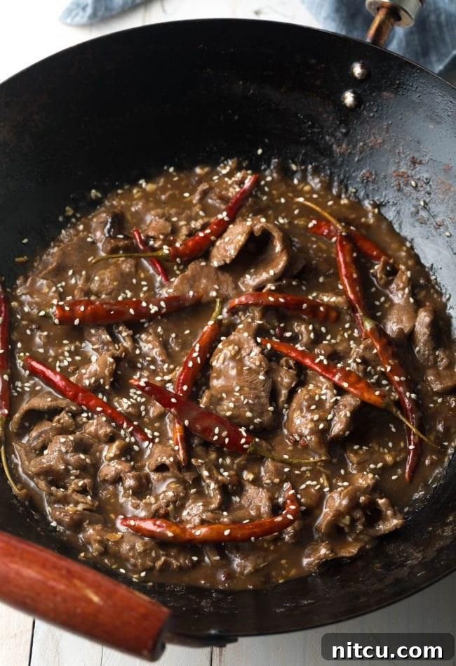 Easy Szechuan Beef Stir-Fry 6 Saute with the peppers and sauces in the pan with the sesame beef