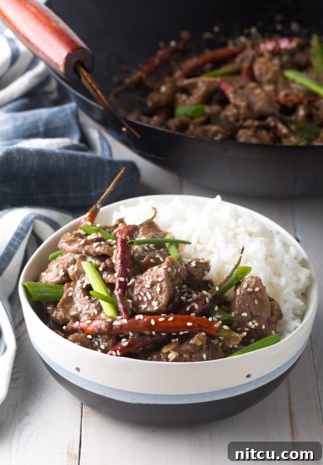 Easy Szechuan Beef Stir-Fry 8 Final Szechuan Beef recipe in a bowl served with some white rice