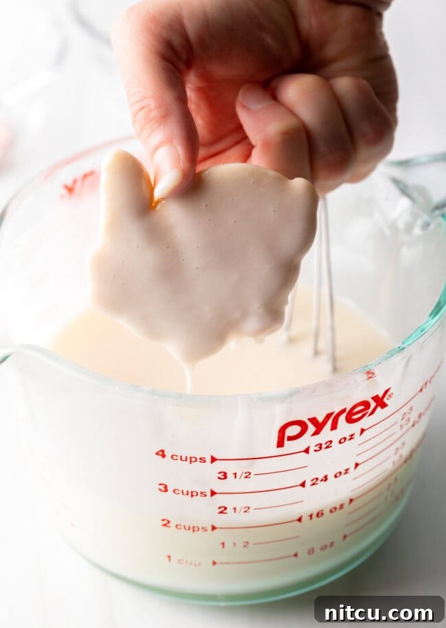 dunk cookies in best cookie icing then set on a rack to dry