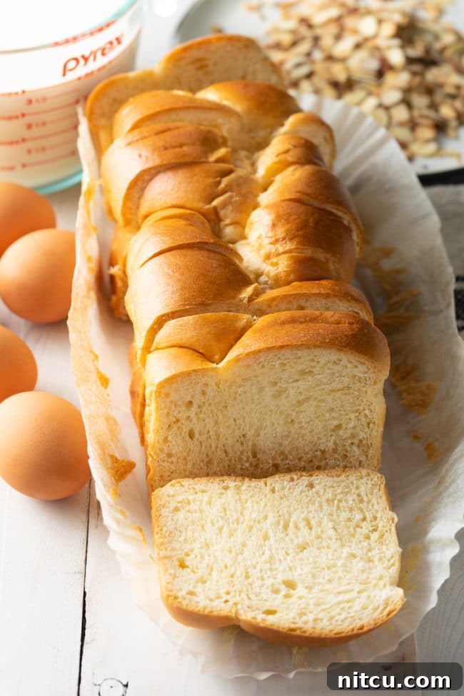 Golden Fluffy French Toast Perfection 6 A loaf of brioche bread that's sliced.