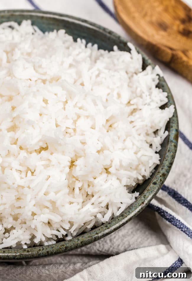 Basmati rice in a gray bowl.