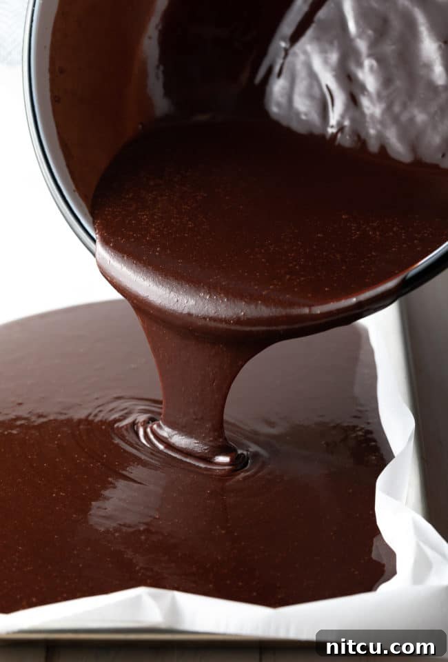 Coffee-Kissed Texas Sheet Cake 4 Pouring sheet cake batter into the sheet pan.