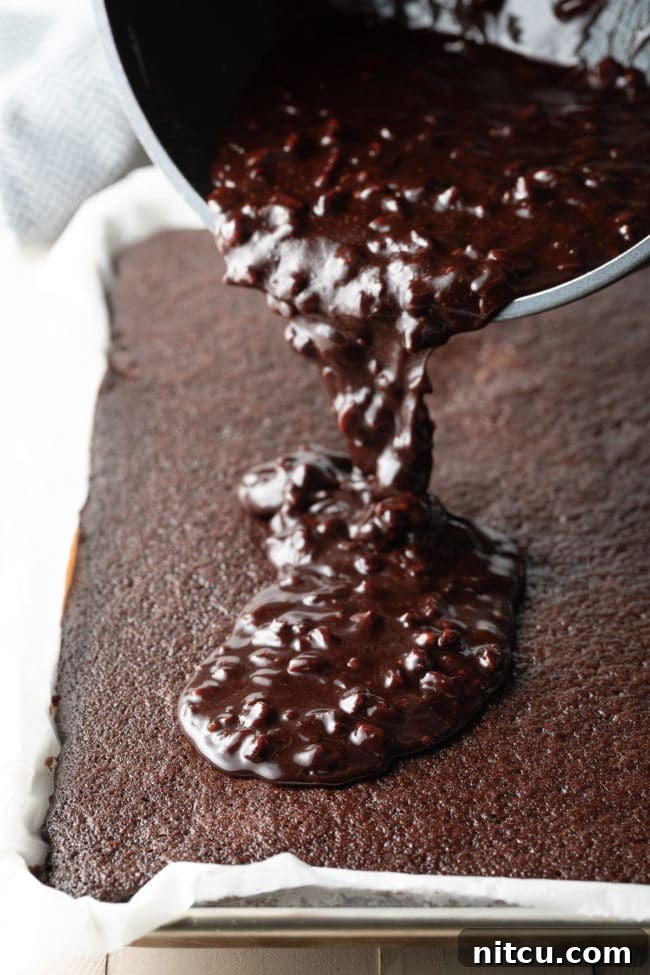 Coffee-Kissed Texas Sheet Cake 6 Pouring chocolate icing on top of sheet cake.