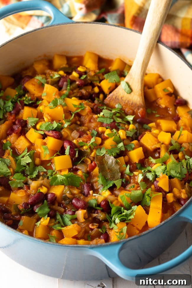 Hearty Butternut Chili 9 A large pot of vegetarian three sisters soup simmering, showing steam rising, ready for serving.