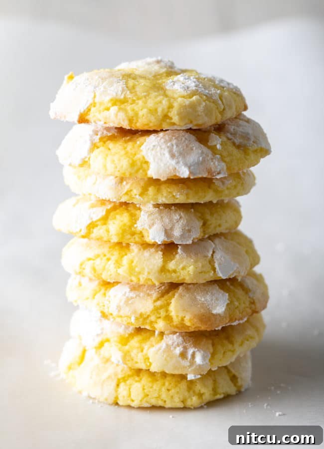 Zesty Lemon Crinkles 5 A beautifully arranged tower of soft, cake-like Lemon Crinkle Cookies, showcasing their delightful texture.