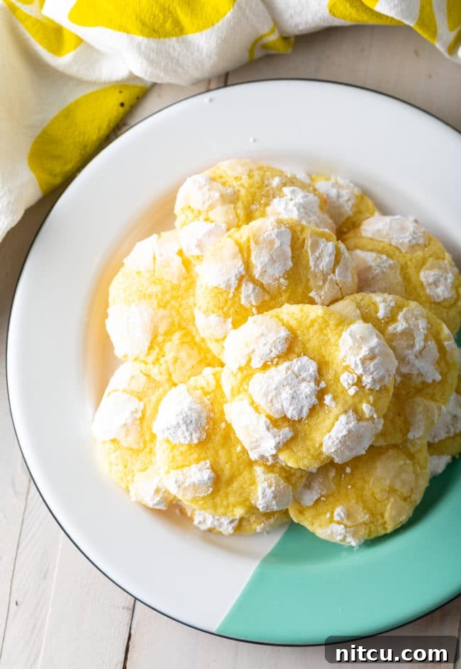 Zesty Lemon Crinkles 10 A delightful display of Lemon Crinkle Cookies, perfect for any occasion. #ASpicyPerspective #cookies #lemon #christmas #easter #best #easy