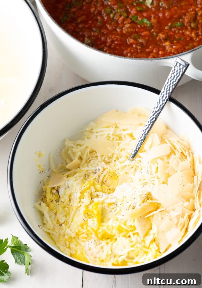 no-boil-method-prep Ricotta mixture in a bowl, ready to be layered into baked ziti recipe
