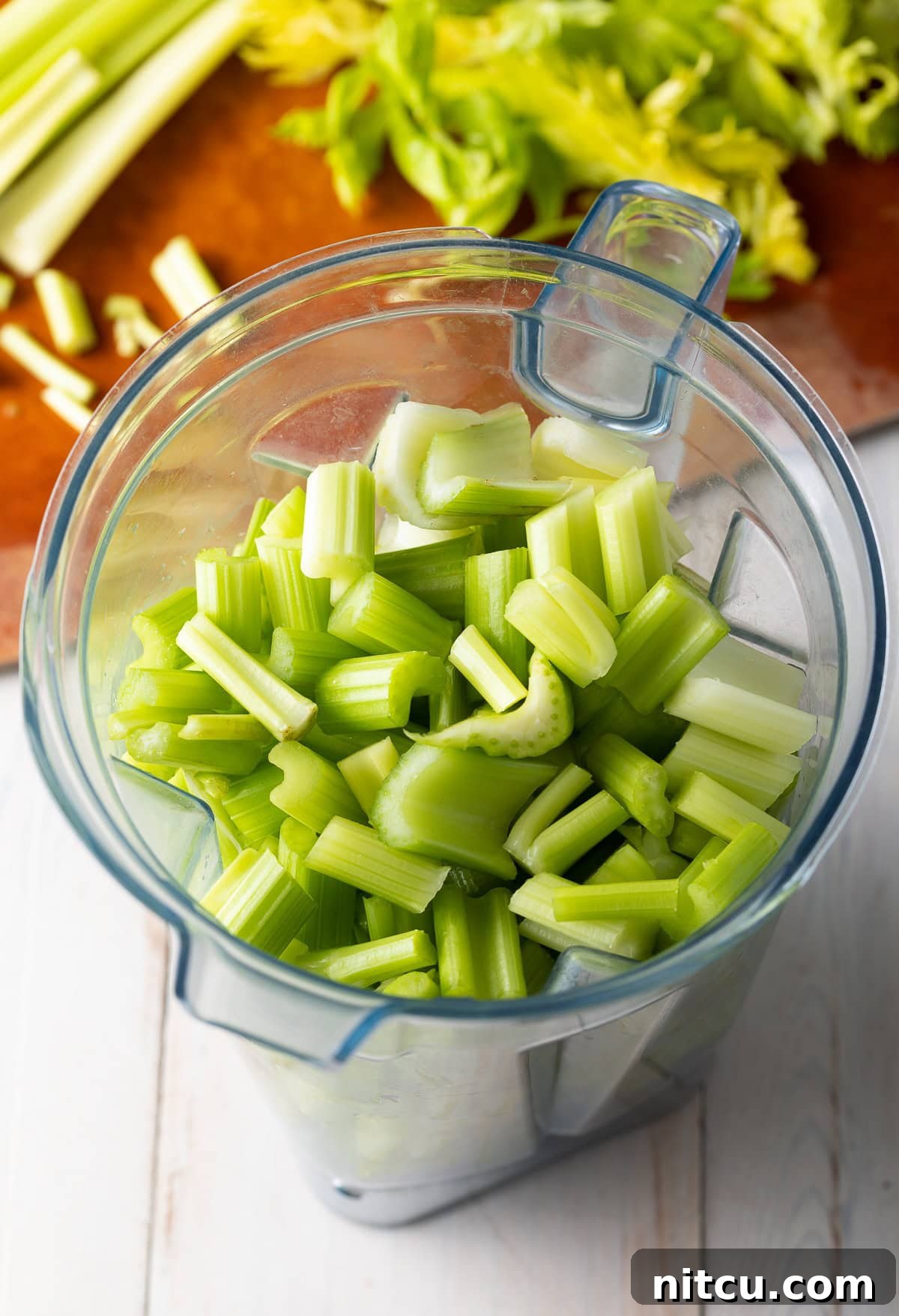 Homemade Celery Juice for Wellness 6 Chopped celery in a blender.