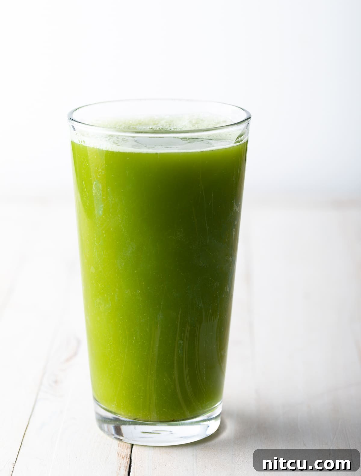 Homemade Celery Juice for Wellness 8 Glass of celery juice.
