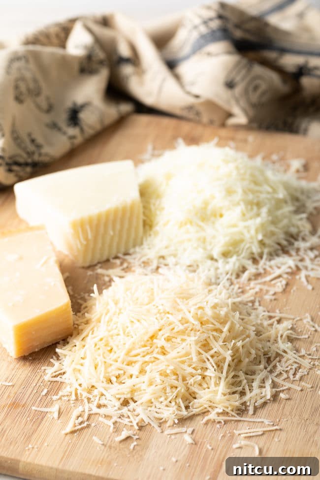 Freshly grated Parmesan cheese, ready for use in Cacio e Pepe.