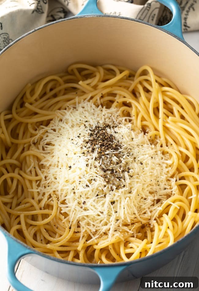 All the Cacio e Pepe ingredients gathered in a pot, ready for cooking.