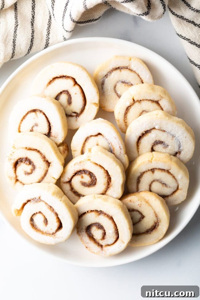 cinnamon-swirl-cookies Overhead shot of freshly baked cinnamon roll cookies arranged on a cooling rack