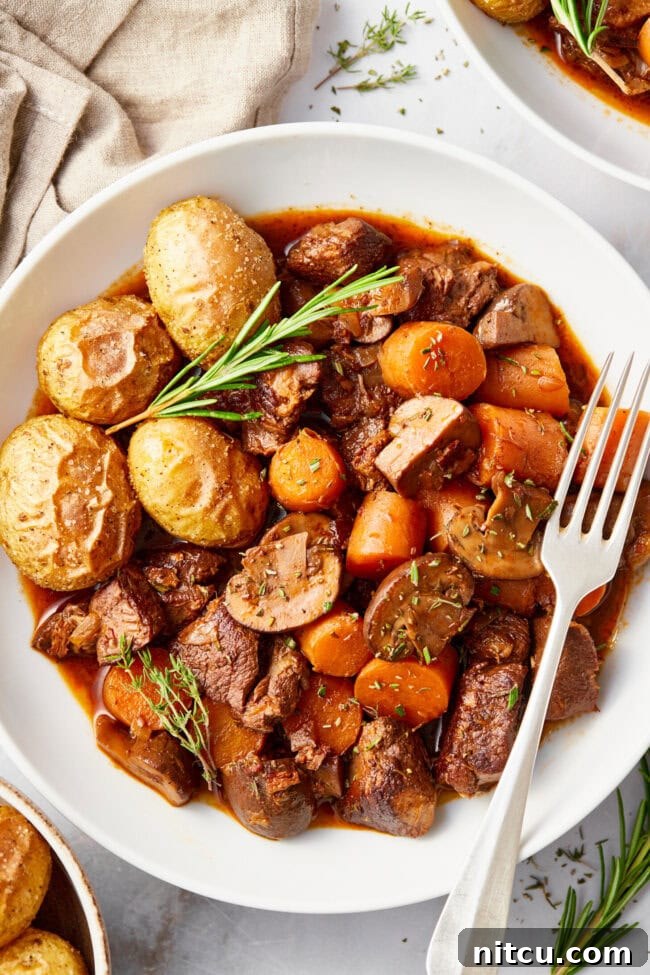 venison-bourguignon.jpg Venison Bourguignon (Deer Stew Recipe) in a white bowl.