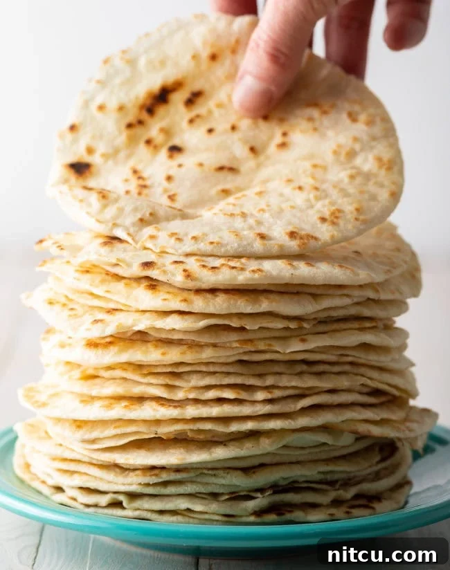 Crafting Perfect Flour Tortillas From Scratch 2 Homemade Flour Tortilla Recipe stacked on plate