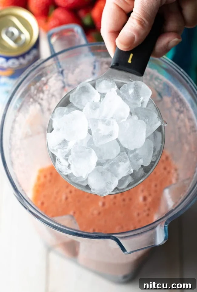 Smoothie King Caribbean Way: Your Tropical Getaway Recipe 6 Cup of ice being added to the blender.