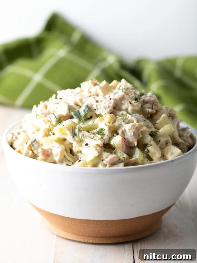 Southern Comfort Chicken Salad 7 Side view of Homemade Chicken Salad in a white bowl.
