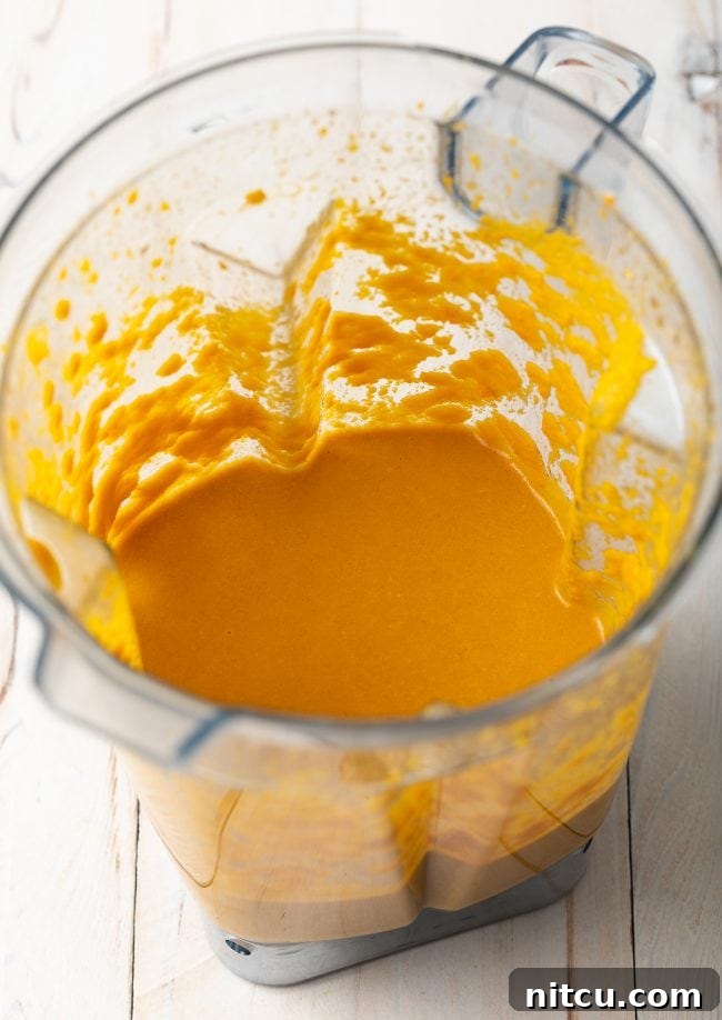 Vibrant Ginger Sesame Dressing 7 Mixed and pureed ingredients for salad dressing in a blender. The transformation of raw ingredients into a smooth, vibrant Japanese Ginger Dressing.