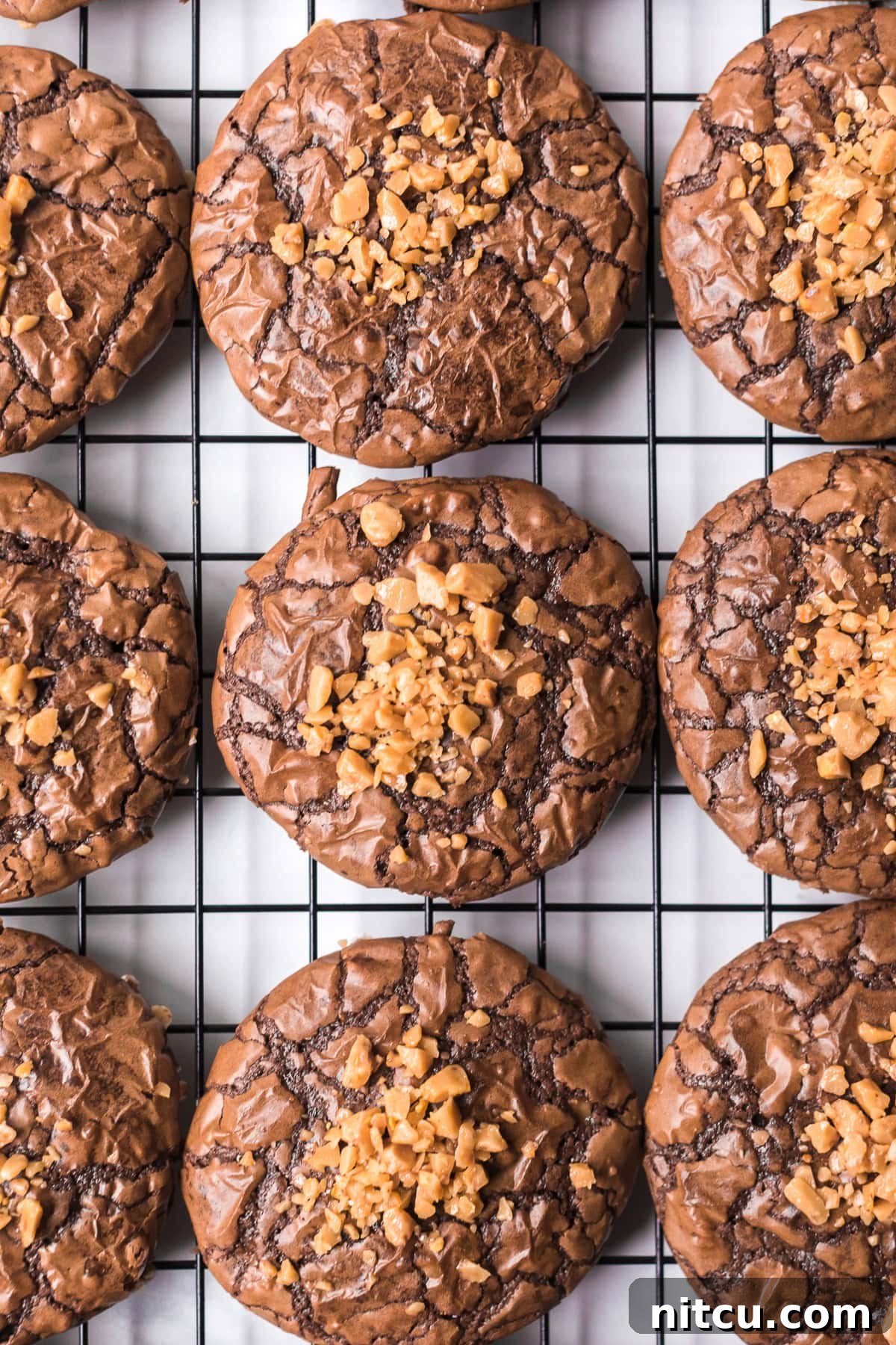 Toffee Fudge Cookies 2 Soft Brownie Cookies with Toffee Bits on cooling rack