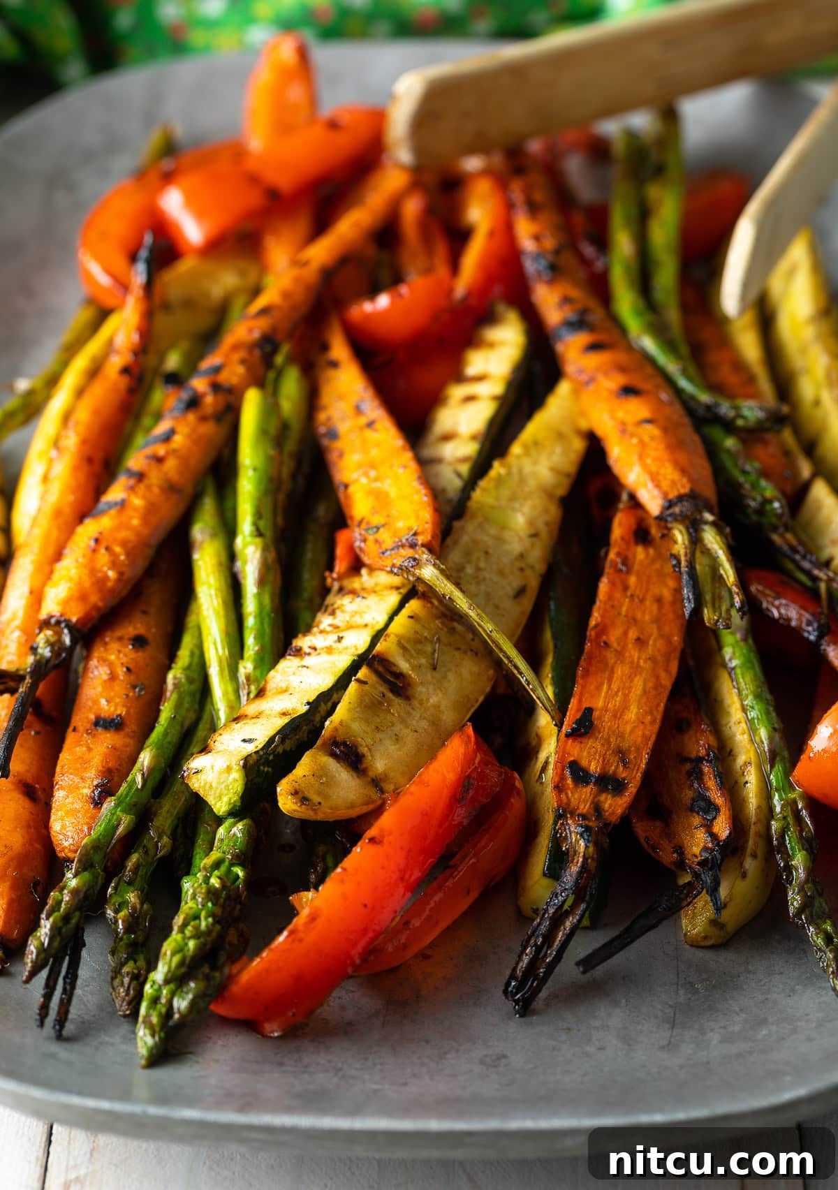 Perfect Grilled Vegetable Marinade 10 Close-up of a large serving platter filled with colorful summer marinated grilled vegetables, ready to be served.