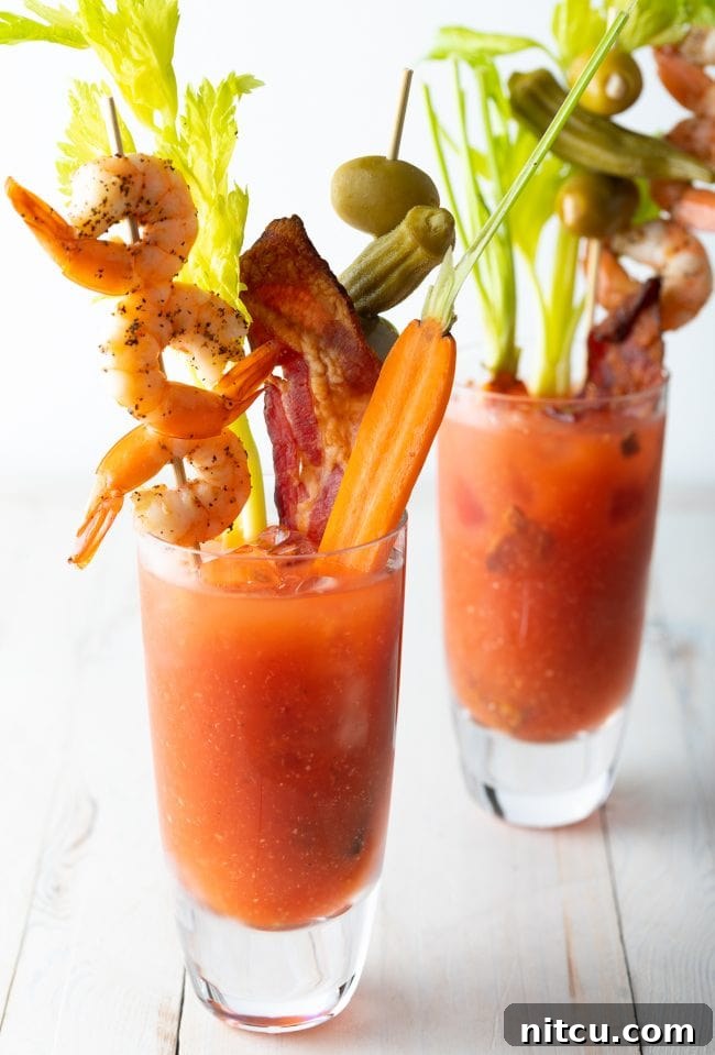 Your Signature Bloody Mary Base 2 Two glasses of Spicy Bloody Mary Mix Recipe with all the toppings.
